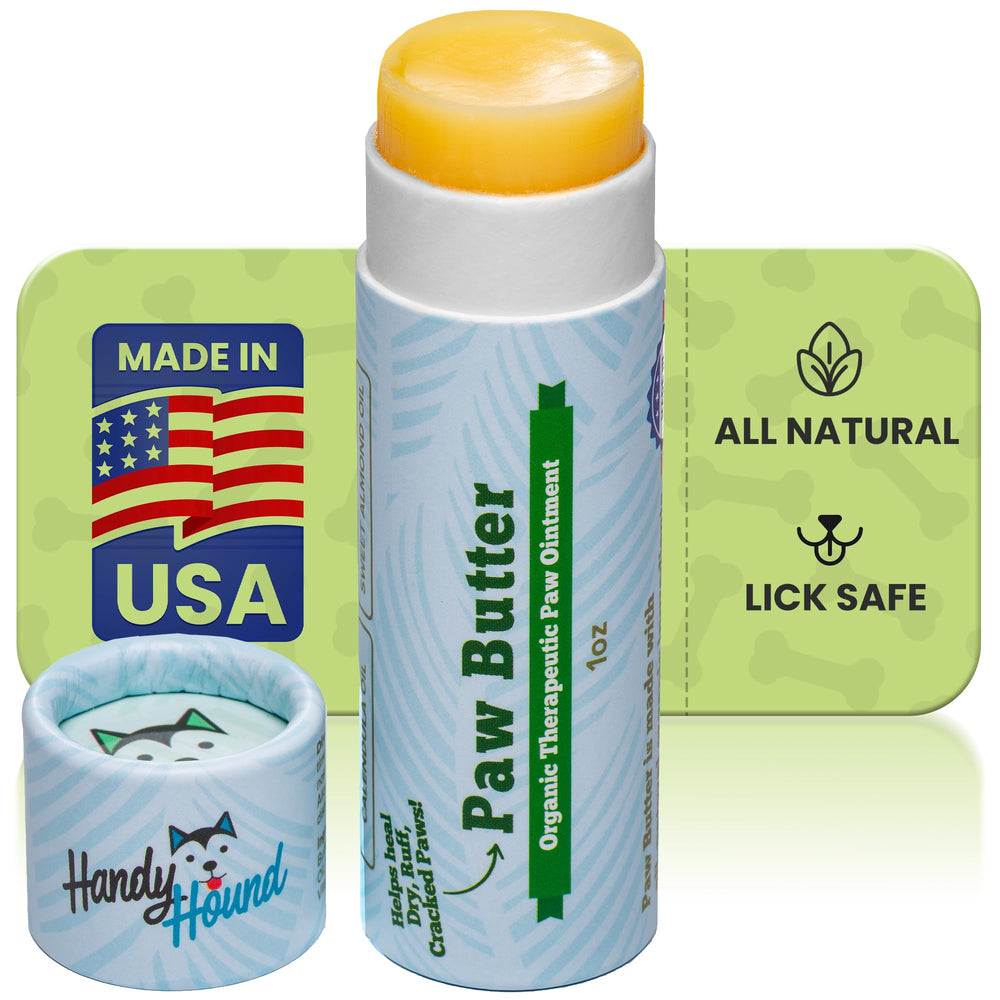 Handy Hound Paw Balm tube applying to paw for quick relief and easy application.
