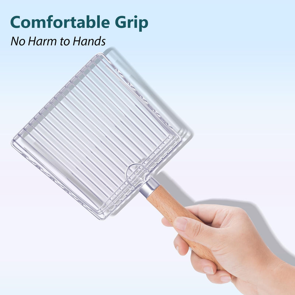 Handzee scoop in use removing clumps for a tidier litter box.