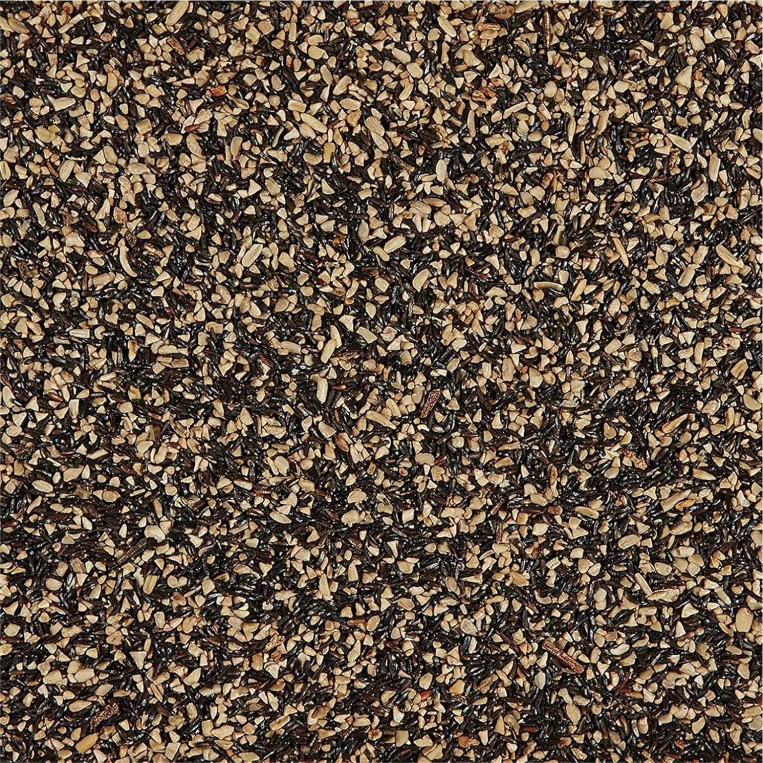 Happy Wings Nyjer seed close-up illustrating tiny seeds loved by finches.