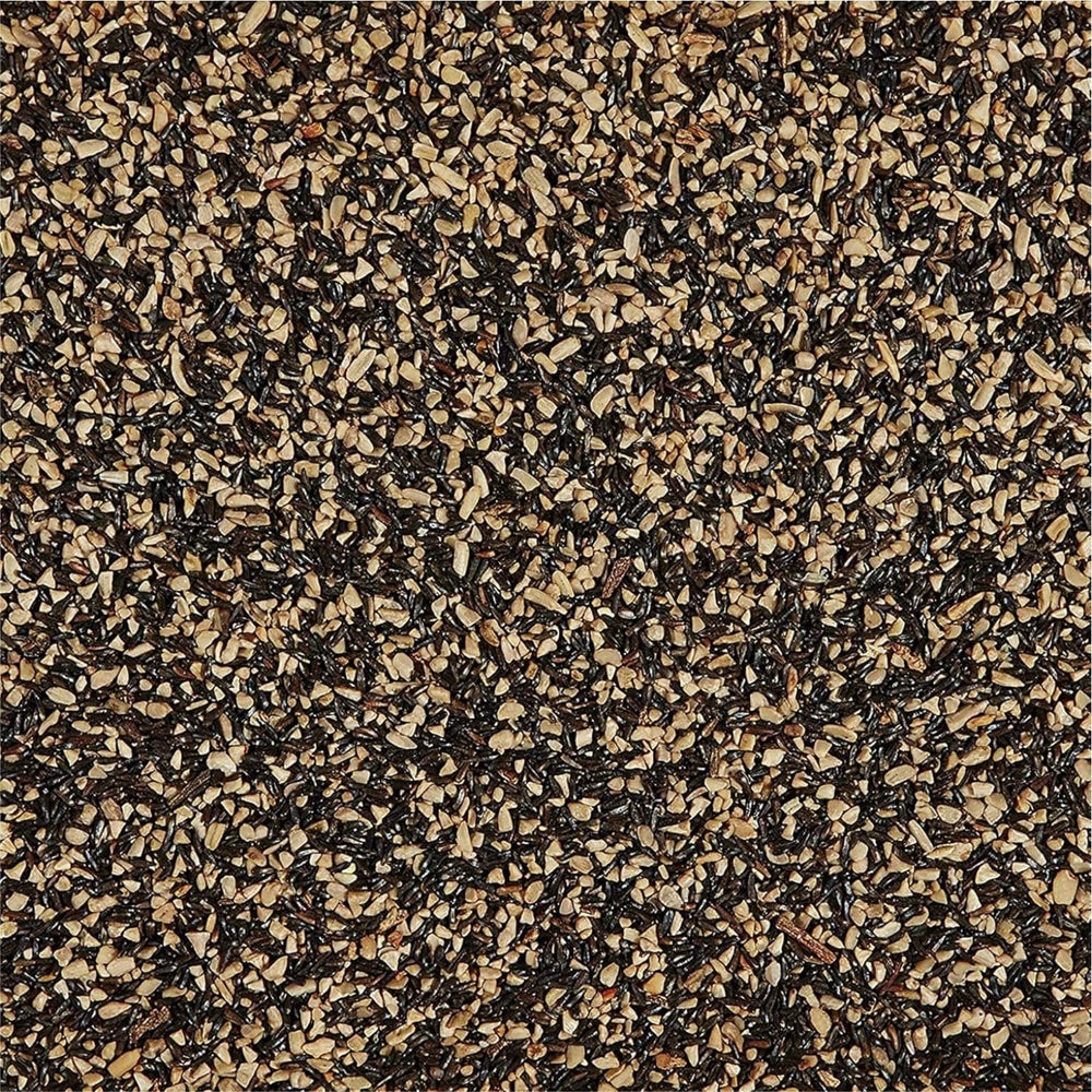 Happy Wings Nyjer seed close-up illustrating tiny seeds loved by finches.