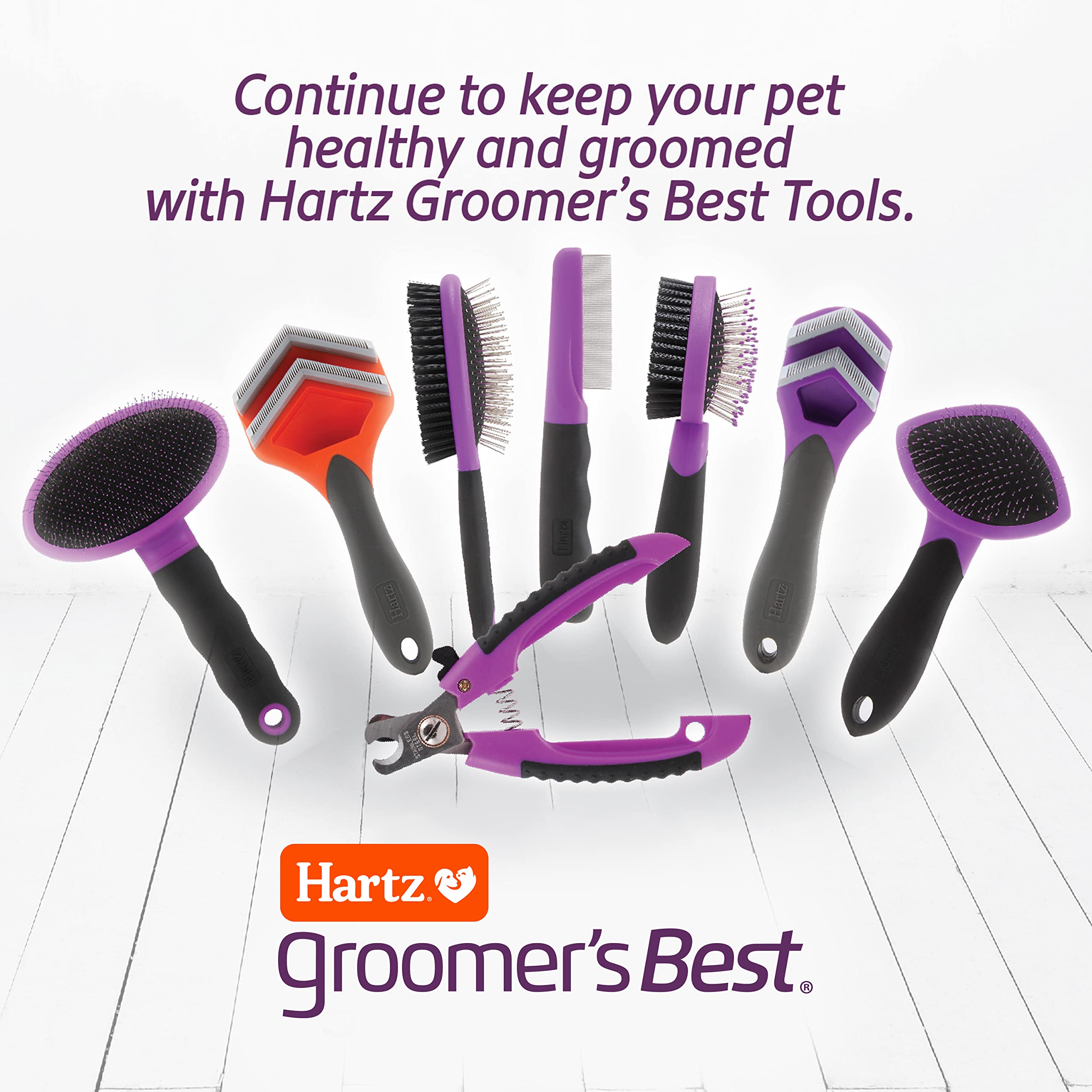 Hartz Groomer's Best Flea Comb removing flea eggs during grooming session.