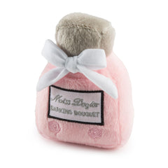 Haute Diggity Dog Miss Dogior perfume bottle toy with pink plush and squeaker for playful engagement.