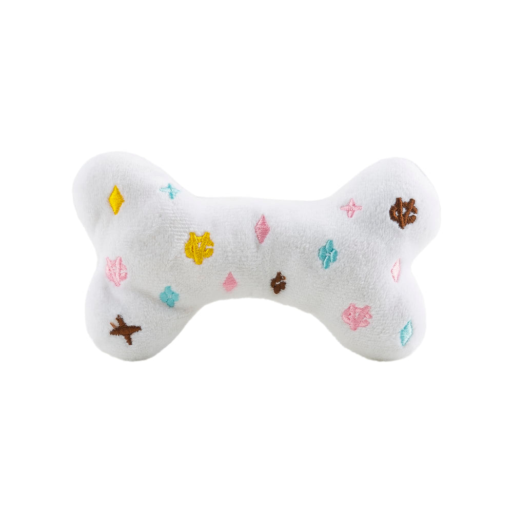 Haute Diggity Dog White Chewy Vuiton Bone squeaker keeps dogs engaged during interactive play.