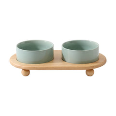 Havniva ceramic elevated cat bowl on stand in light green for comfortable feeding.