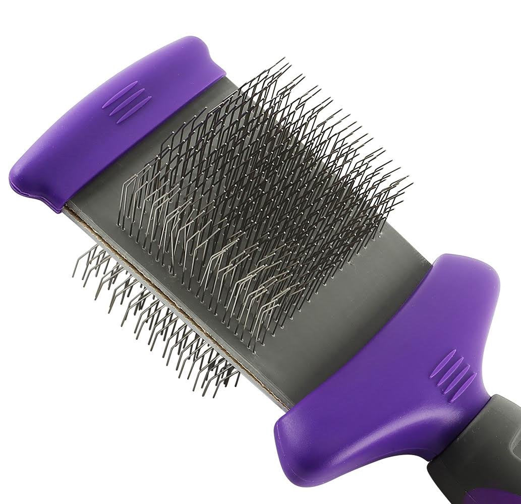 Hertzko flexible head slicker brush in use contours to pet’s body for comfortable brushing