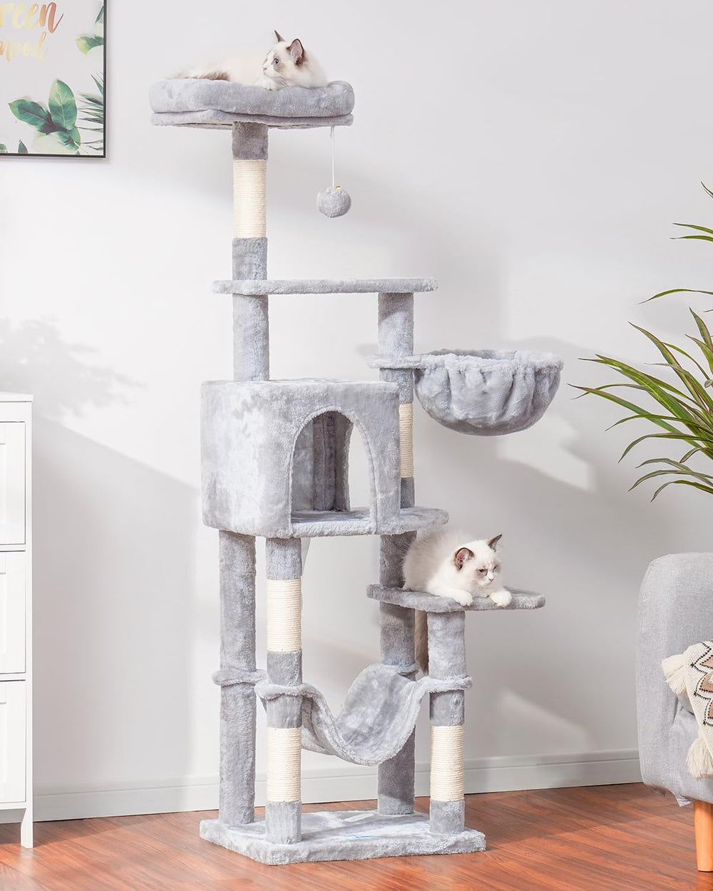 Hey-brother cat tree pompoms add playful texture to the living space