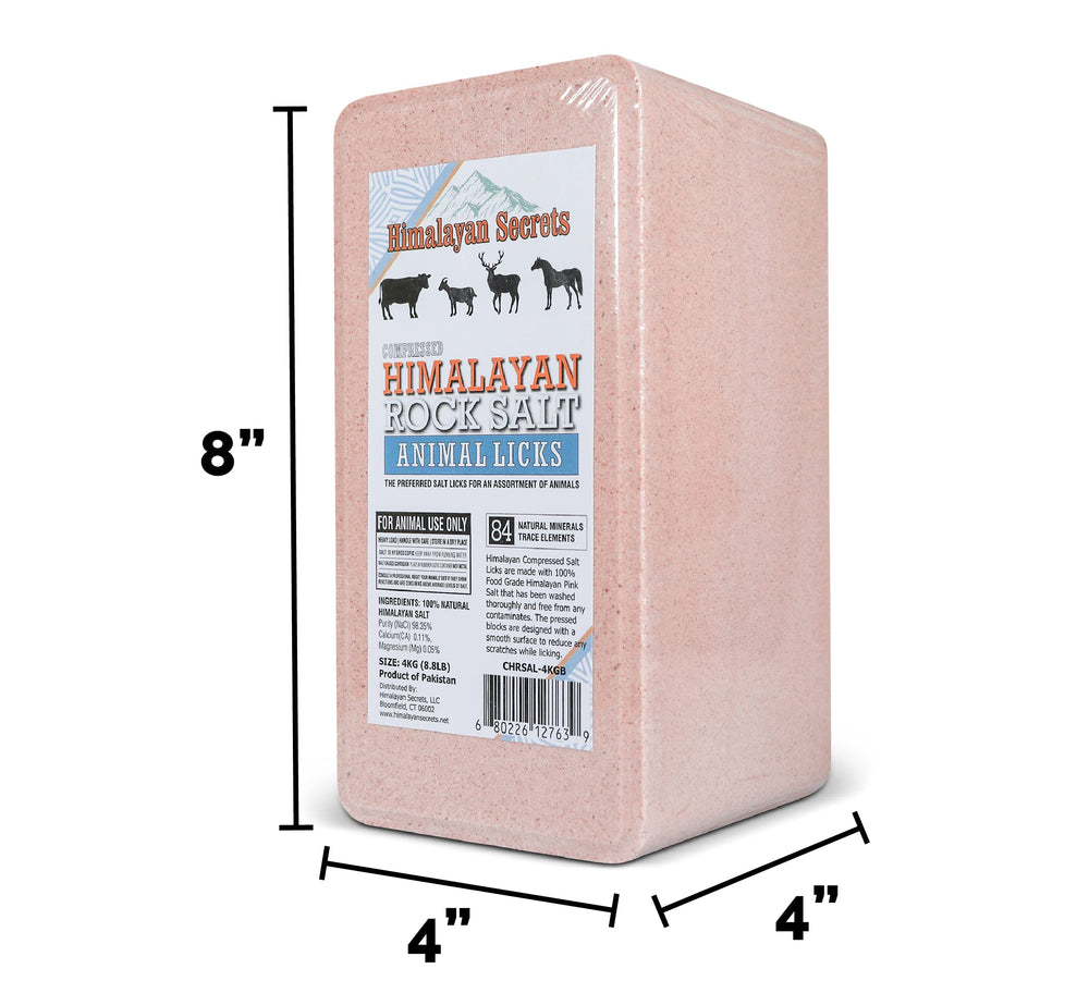 Himalayan Secrets pink salt brick outdoors in pasture with grazing animals