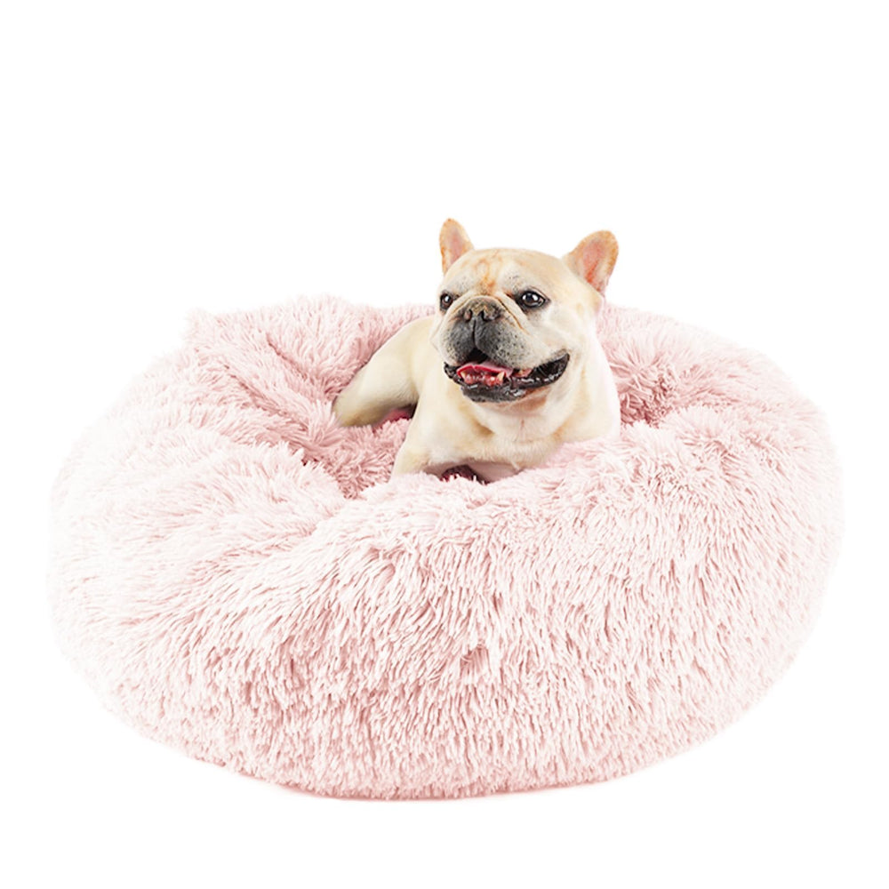 Himax pink donut dog bed offers a plush, inviting resting space for calm downtime.
