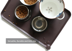 Hoki Found 24x16-inch mat with raised edge catches spills.