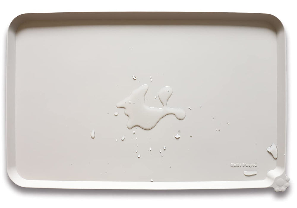Bandeja de silicona Hoki Found crema-marrón con borde alto para evitar derrames.