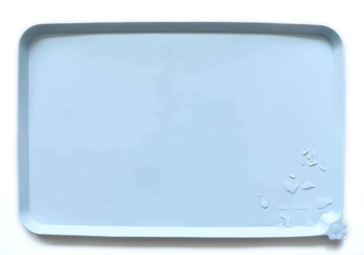 Hoki Found L silicone non-slip bowl mat with spillproof shield protects floors.