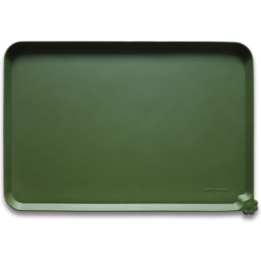 Hoki Found L silicone non-slip bowl mat in dark olive protects floors during meals.