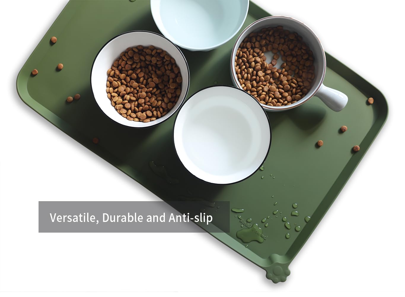 Hoki Found L silicone non-slip bowl mat in dark olive is travel-friendly for tidy meals on the go.
