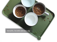 Hoki Found L silicone non-slip bowl mat in dark olive is travel-friendly for tidy meals on the go.
