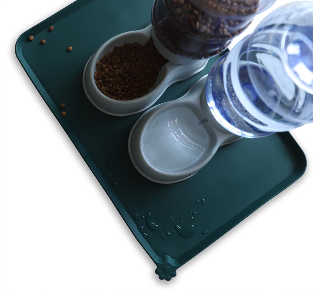 Hoki Found large silicone pet food mat being wiped clean after use.