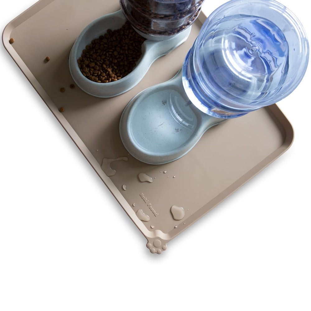 Hoki Found raised-edge tan mat detail illustrating extra lip to prevent mess.
