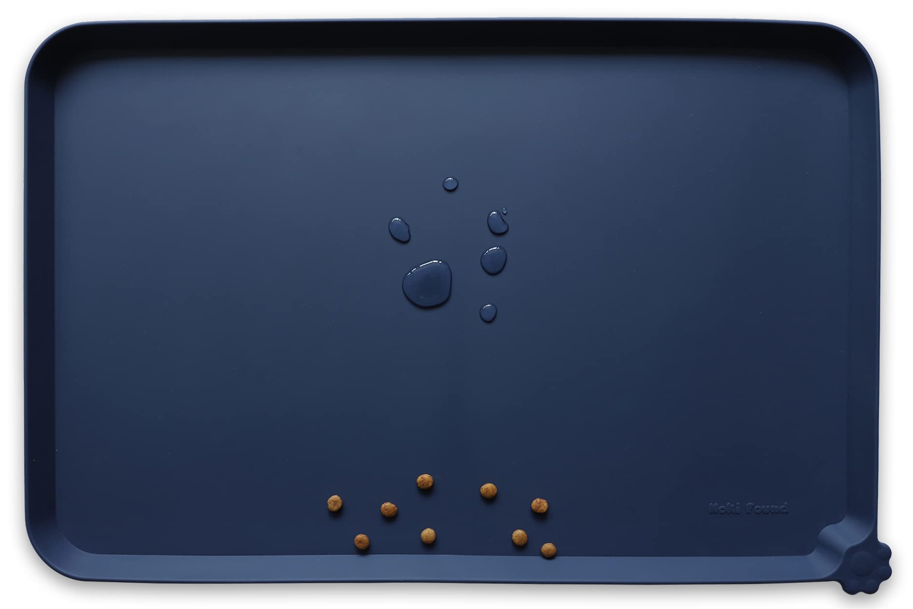 Hoki Found L silicone non-slip placemat close-up shows spill containment for pet meals.