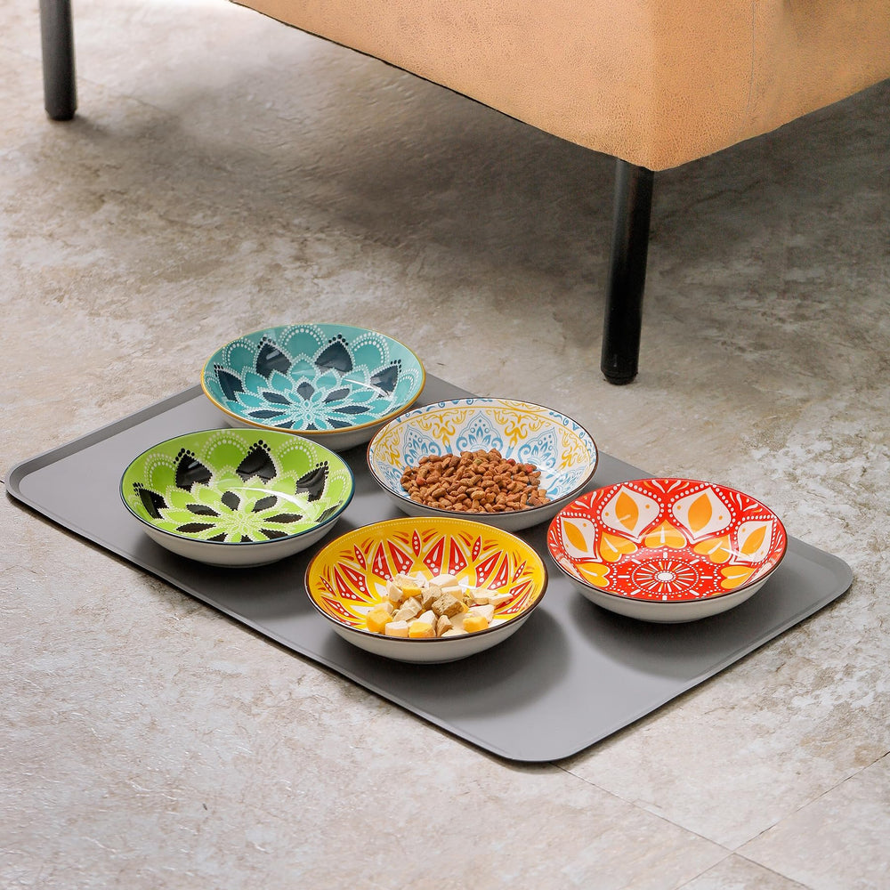 Howise silicone mat under cat bowls provides spill protection and easy cleanup.