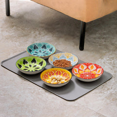 Howise silicone mat under cat bowls provides spill protection and easy cleanup.