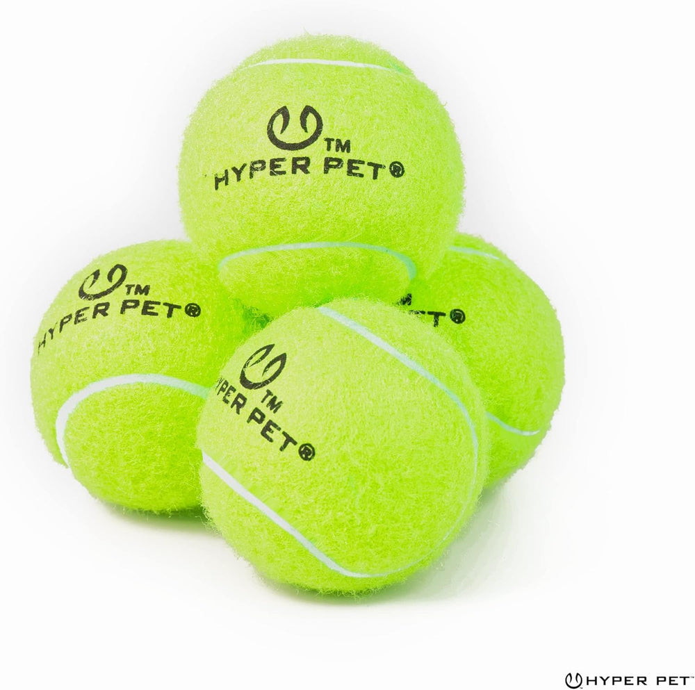 Hyper Pet mini tennis ball in grass for quick visibility during play.