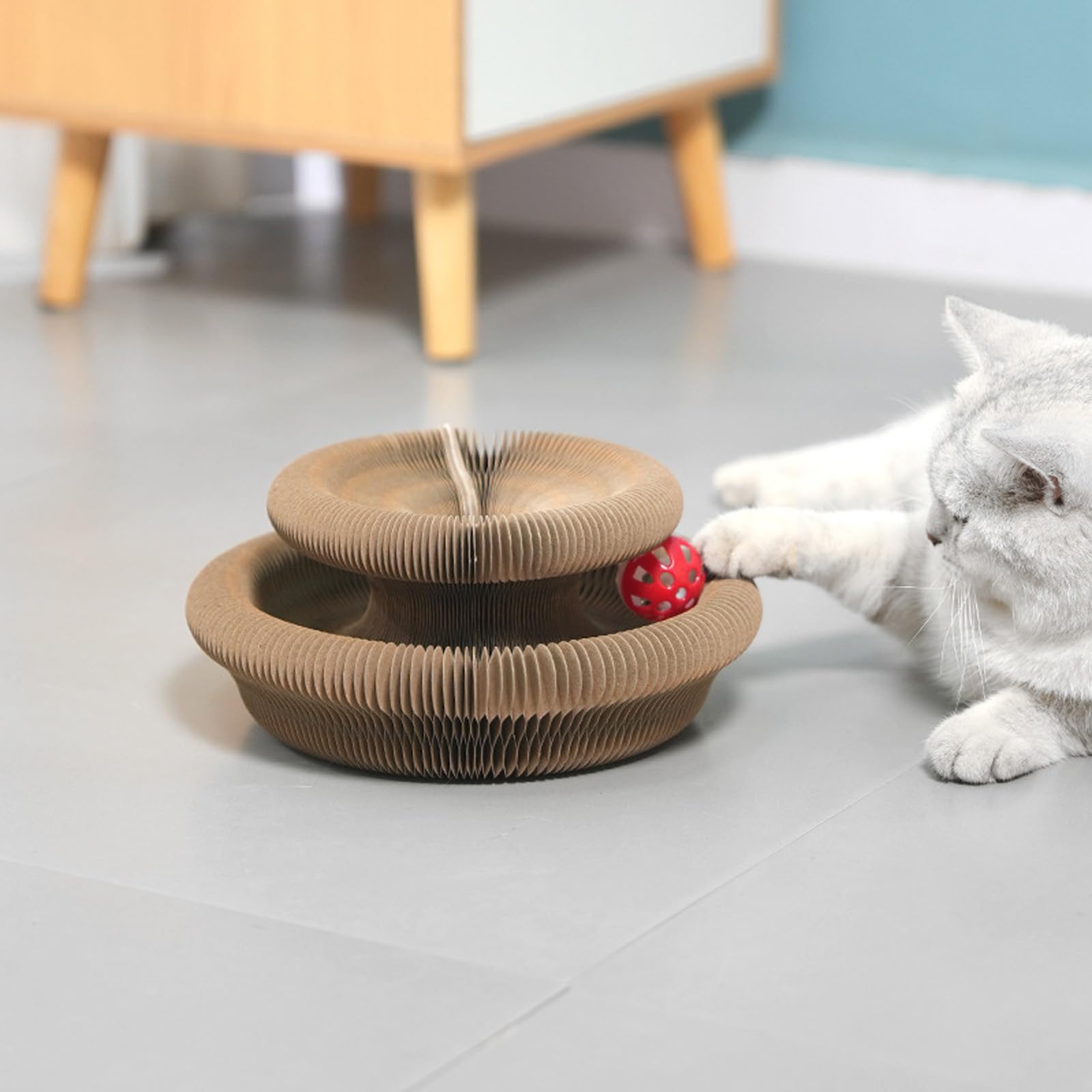 HYuMCCyhT interactive scratch pad with ball track illustrates playful engagement.