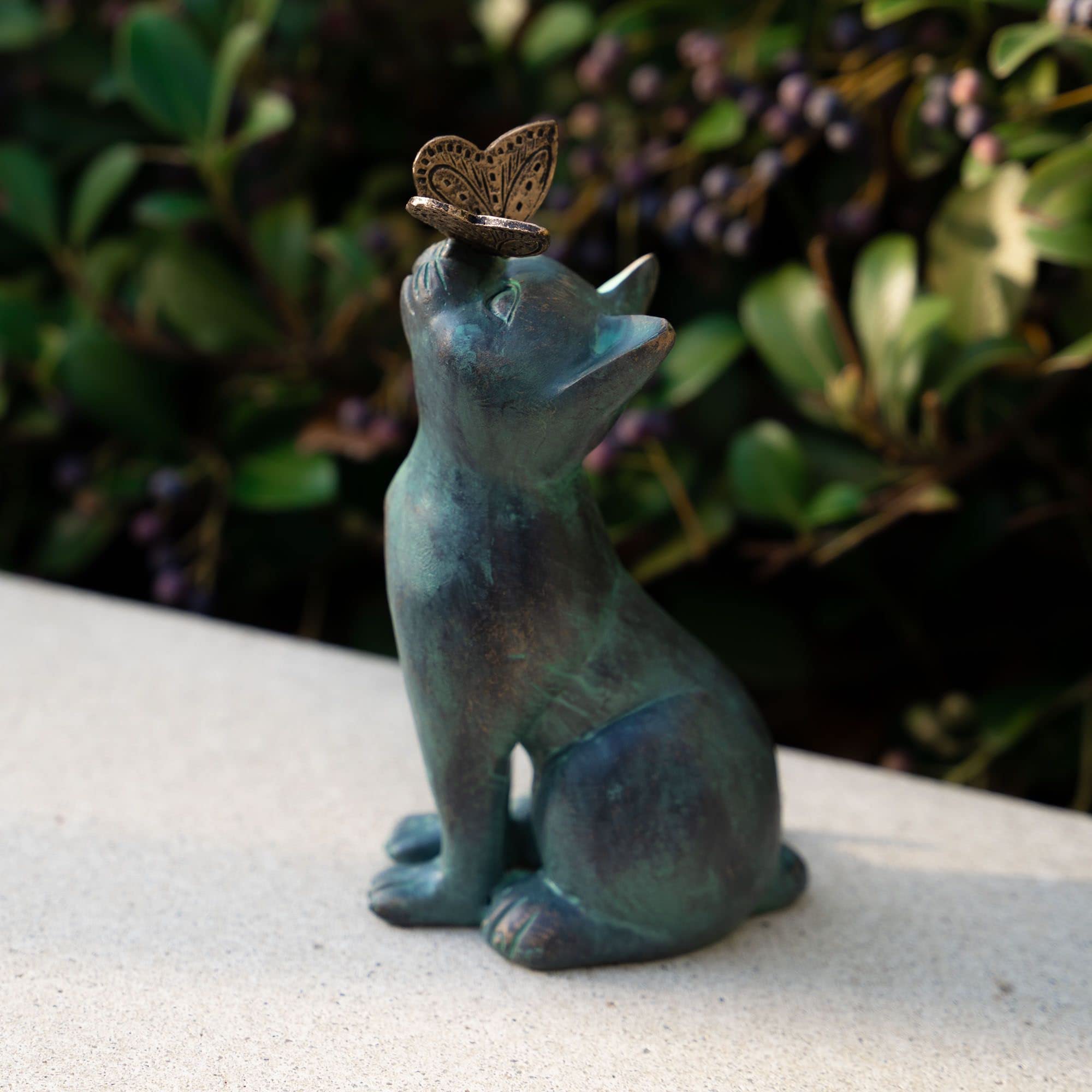 iHeartCats Cat Memorial Figurine in garden setting emphasizes a charming, weatherproof keepsake for pet tributes.