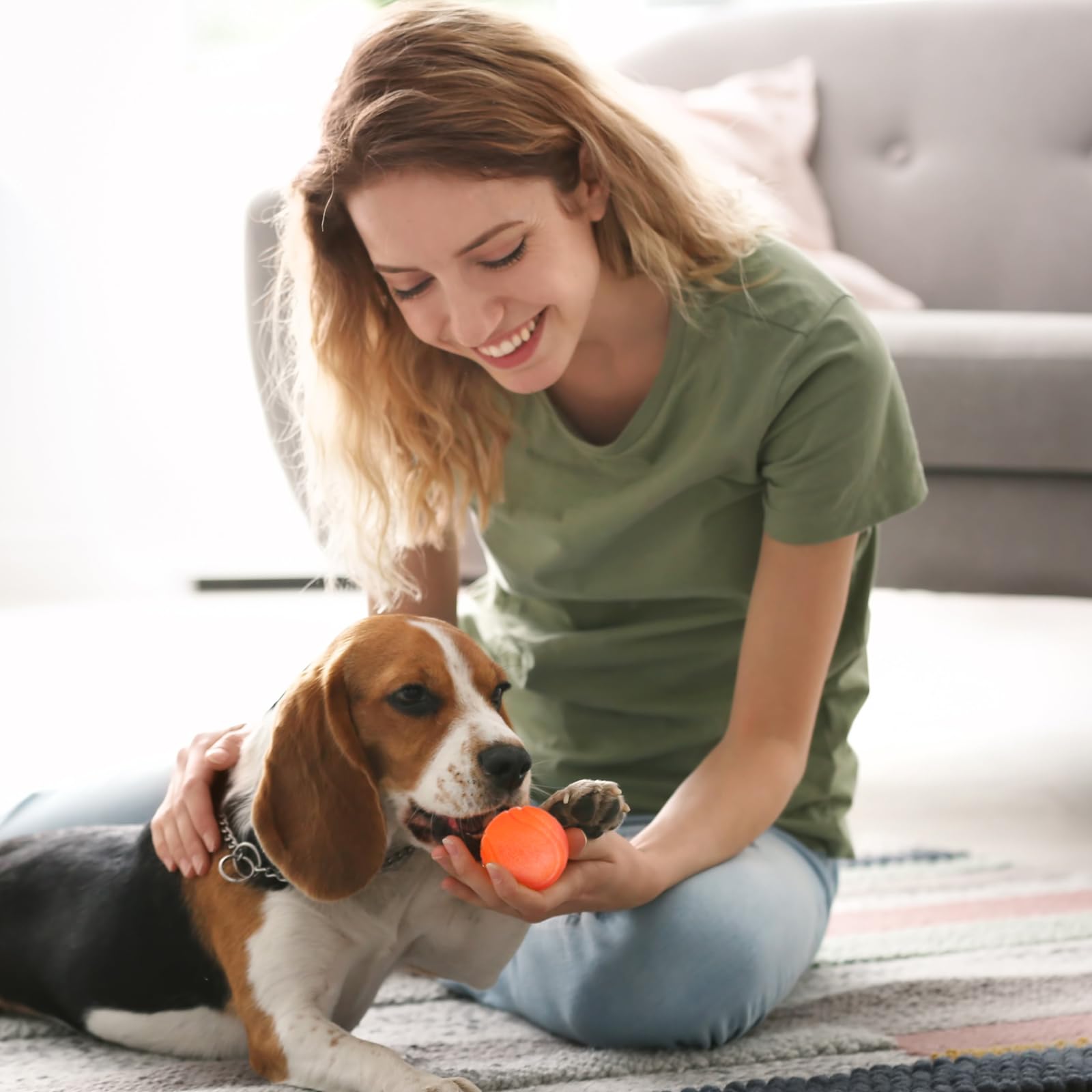 Jenaai orange 2in ball offers bounce-driven exercise for dogs and owners.