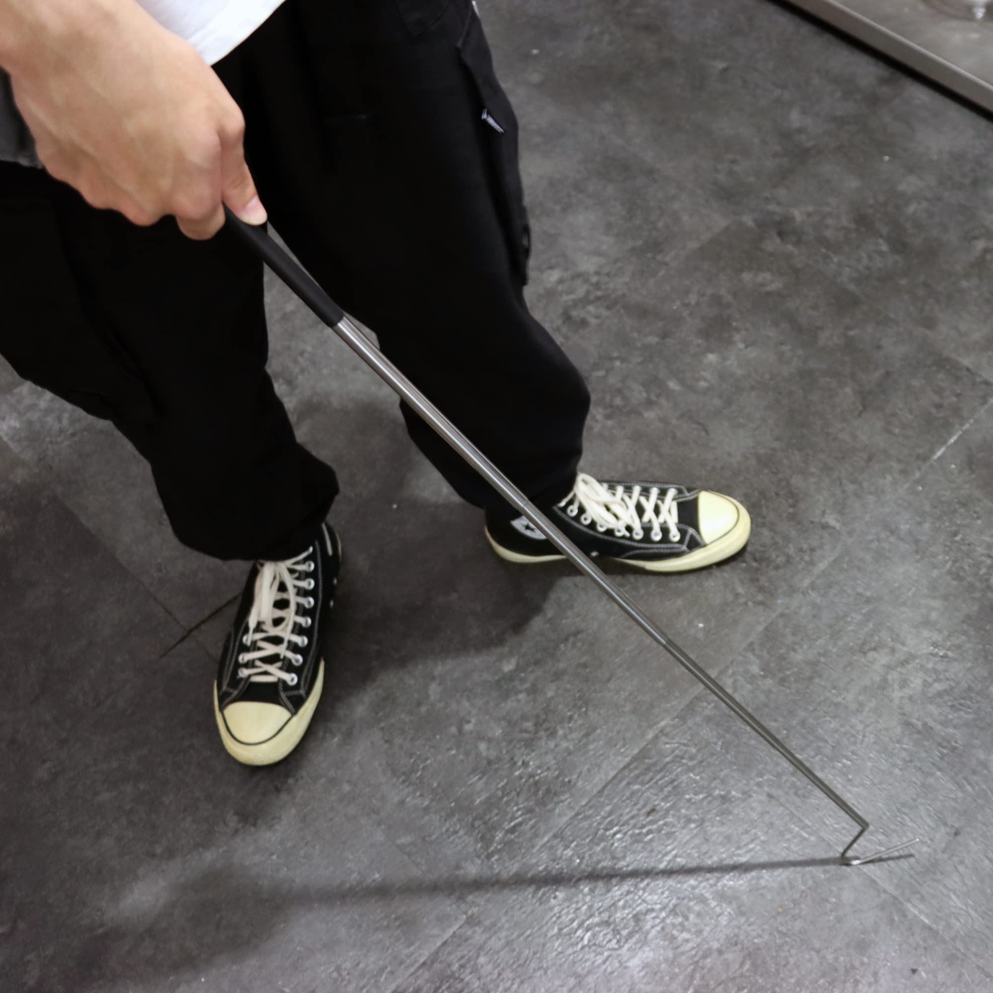 JIHAQUA snake hook in use during reptile encounter highlighting safe handling