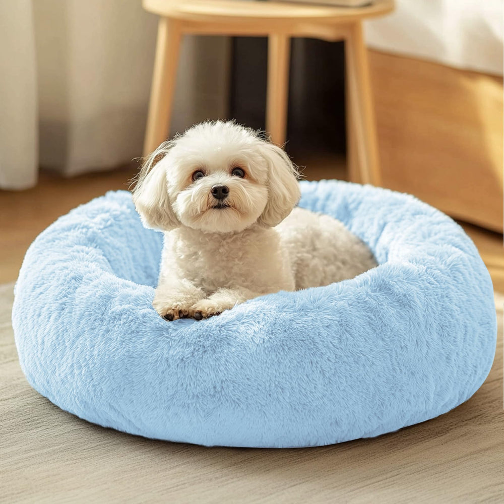 JOLLYVOGUE dog and cat bed in plush faux fur offers cozy warmth for pets.