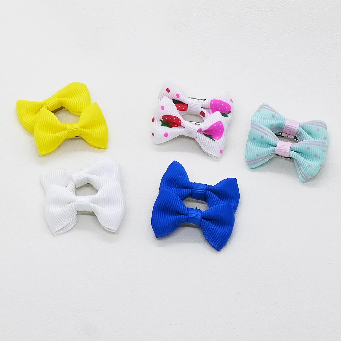 JUCCPUL dog hair bows photoshoot-ready with vibrant patterns.