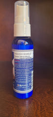 KeriCure Tough Shield spray on paw showing convenient application