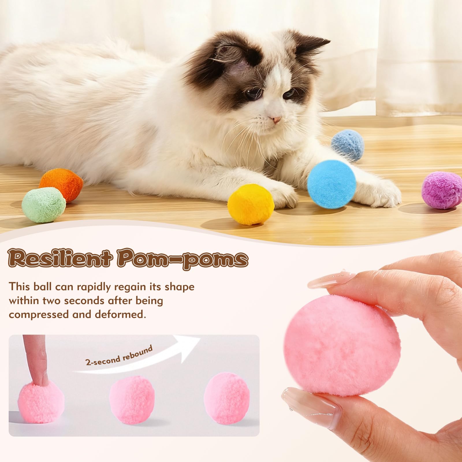 Kerros cat chasing pom poms, stimulating hunting instincts with gentle reactivity.