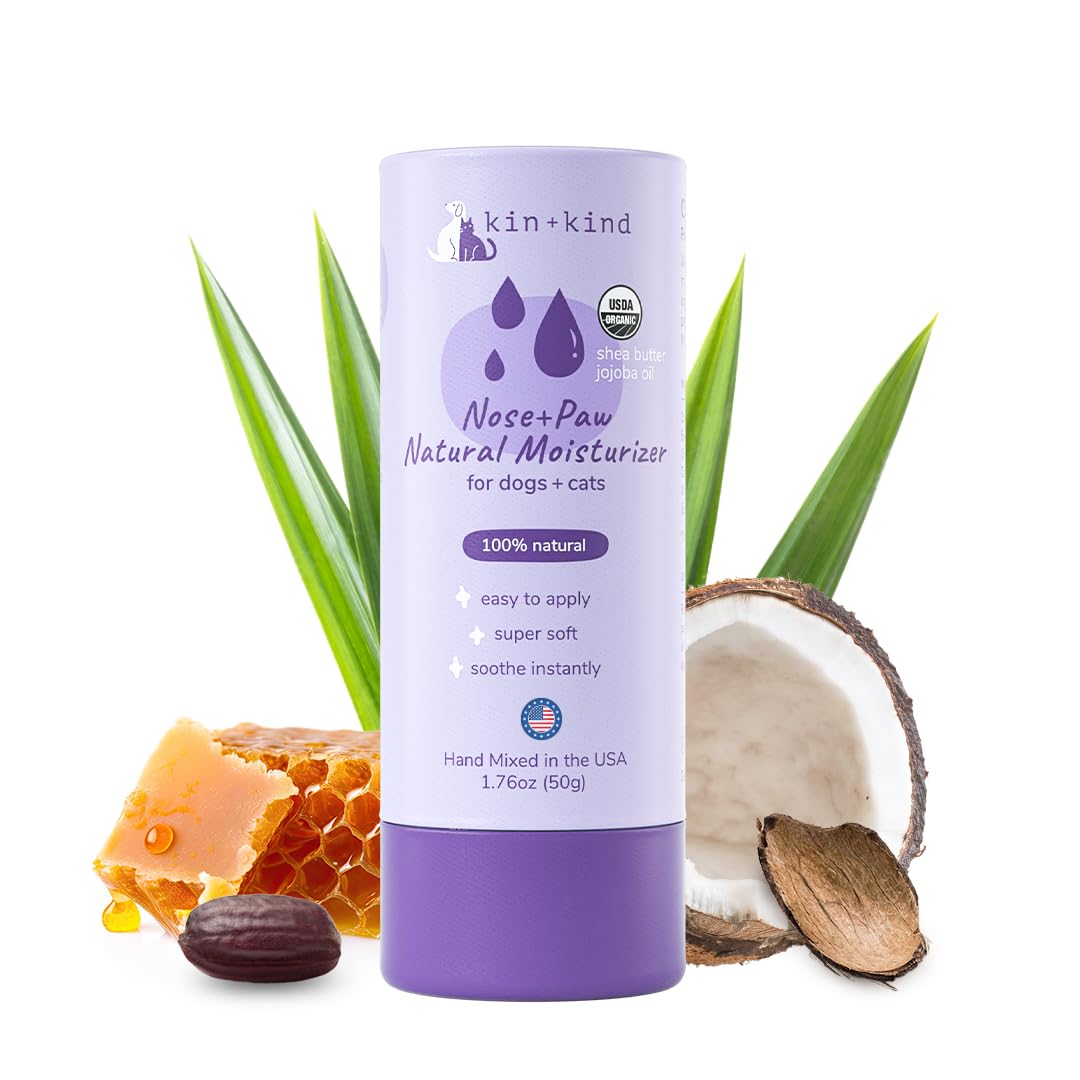 kin+kind nose and paw balm stick applied to a paw for roll-on relief.