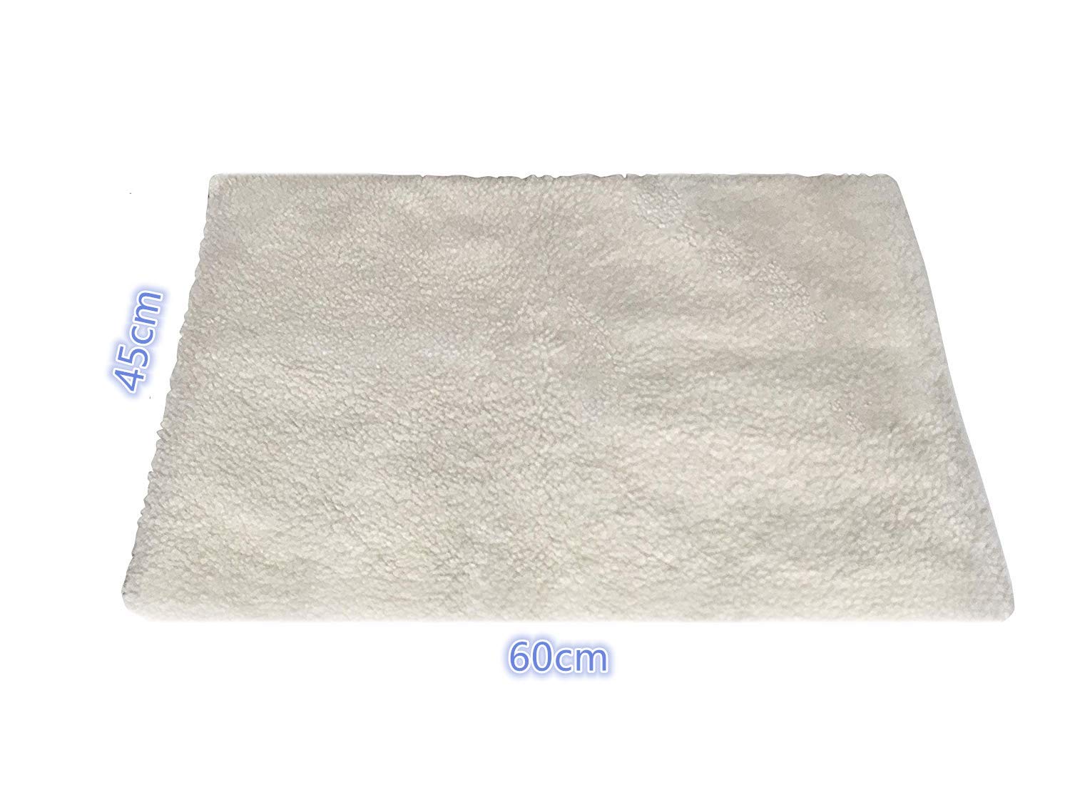 Klemon Self-Warming Pad on bed scene shows easy placement for any pet bed.