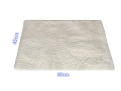 Klemon Self-Warming Pad on bed scene shows easy placement for any pet bed.