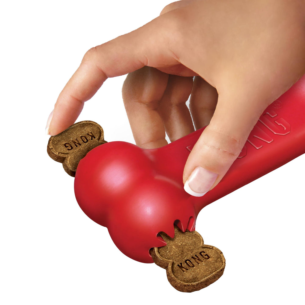 KONG Goodie Bone red stuffed with kibble—interactive feeding and mental engagement.