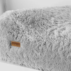 KOPEKS memory foam dog bed headrest and pillow close-up for neck comfort.