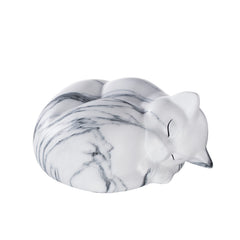 Kriss Art pet urn white on shelf blends with decor during remembrance.