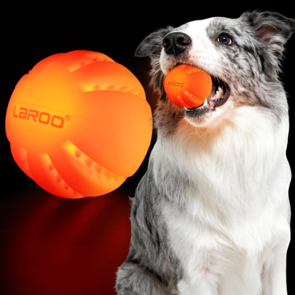 LaRoo Light Up Dog Ball front view glowing orange for nighttime fetch.
