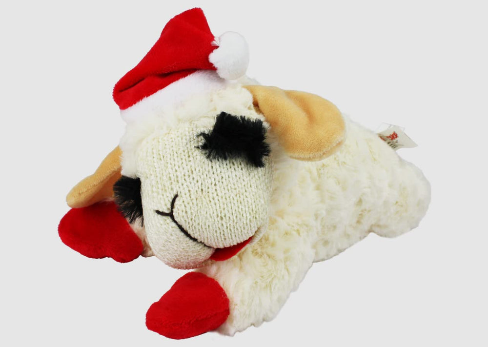 Lamb Chop plush squeaky toy in holiday attire keeps dogs engaged.