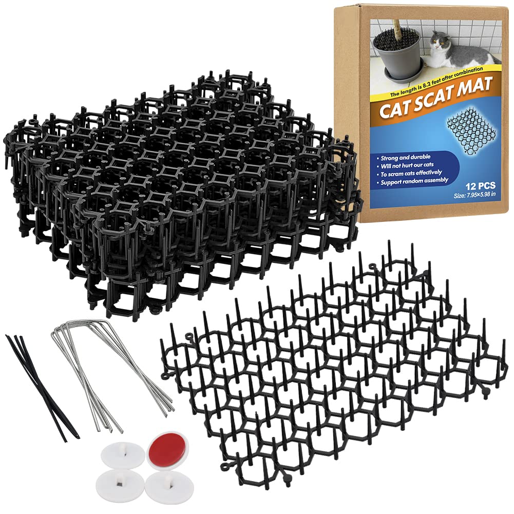 Ley's cat deterrent mat 6x8in in garden setup protects plants from digging.