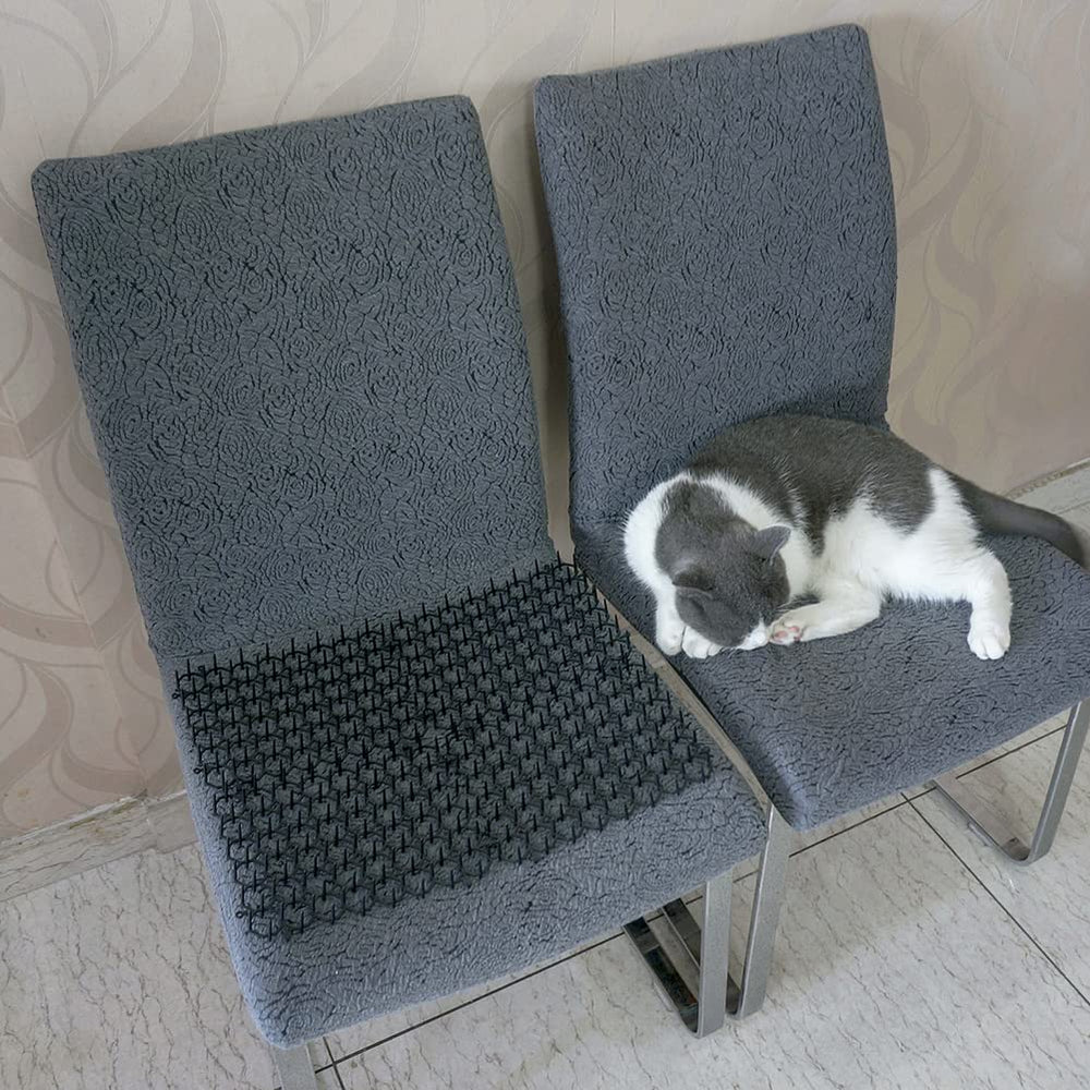 Ley's cat deterrent mat packaging includes stakes and ties for quick installation.