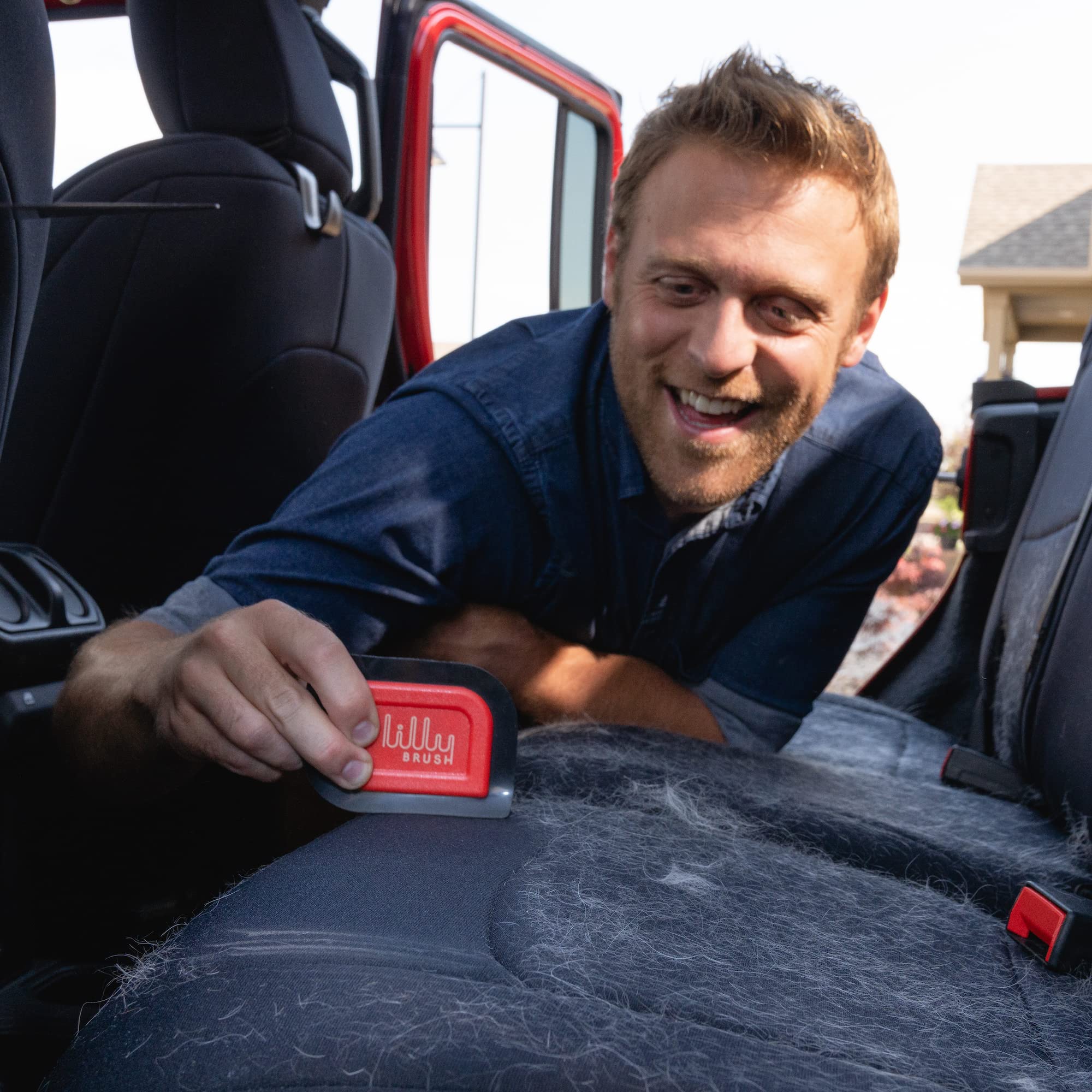 Lilly Brush Mini Pet Hair Detailer cleans car mats for a fresher ride.