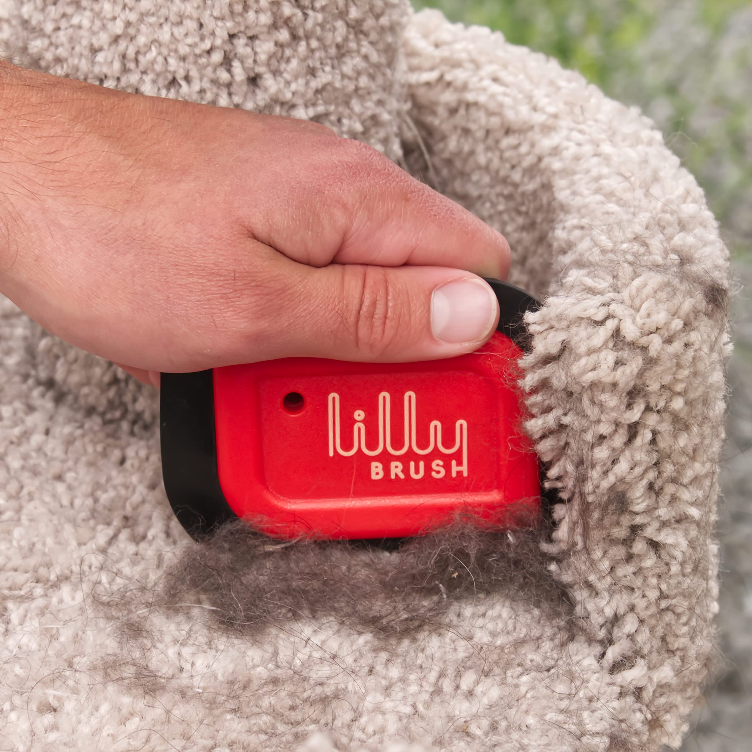 Lilly Brush Mini Pet Hair Detailer used on stairs for tidy fabric.