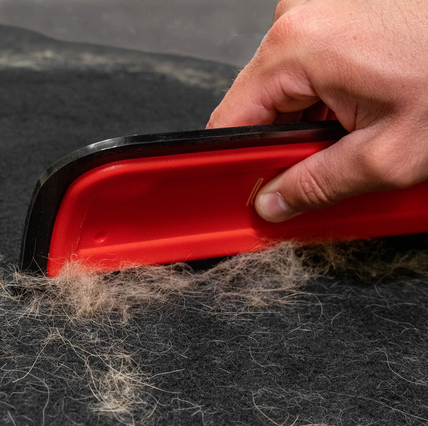 Lilly Brush Pro in-car interior cleaning detail showing hair removal action