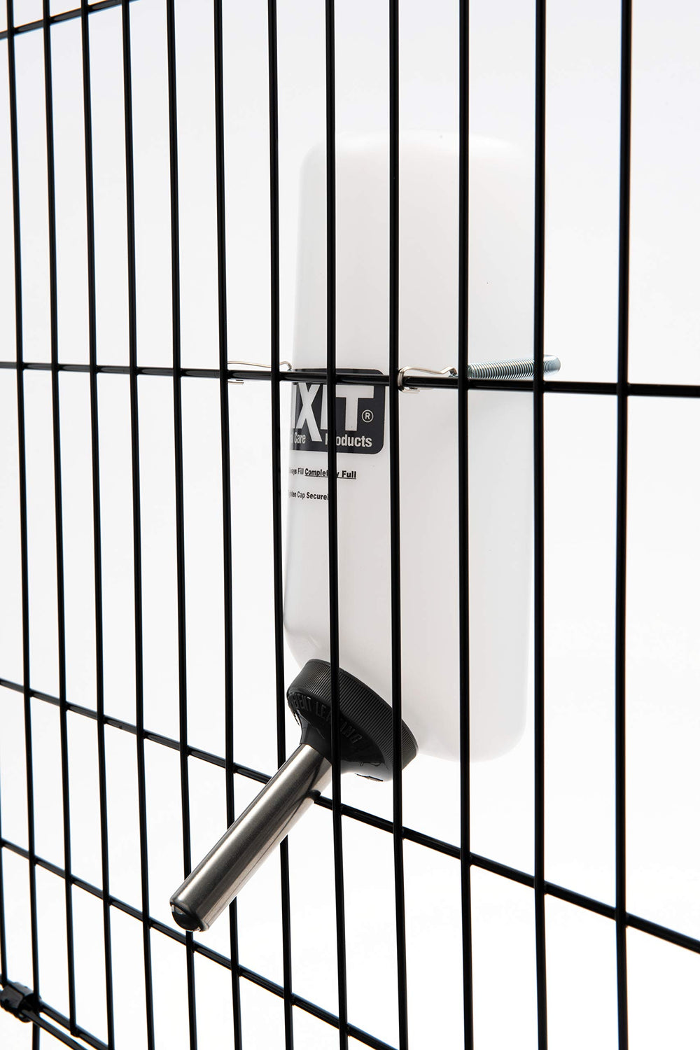 White Lixit bottle aesthetic complements crates while keeping hydration accessible.