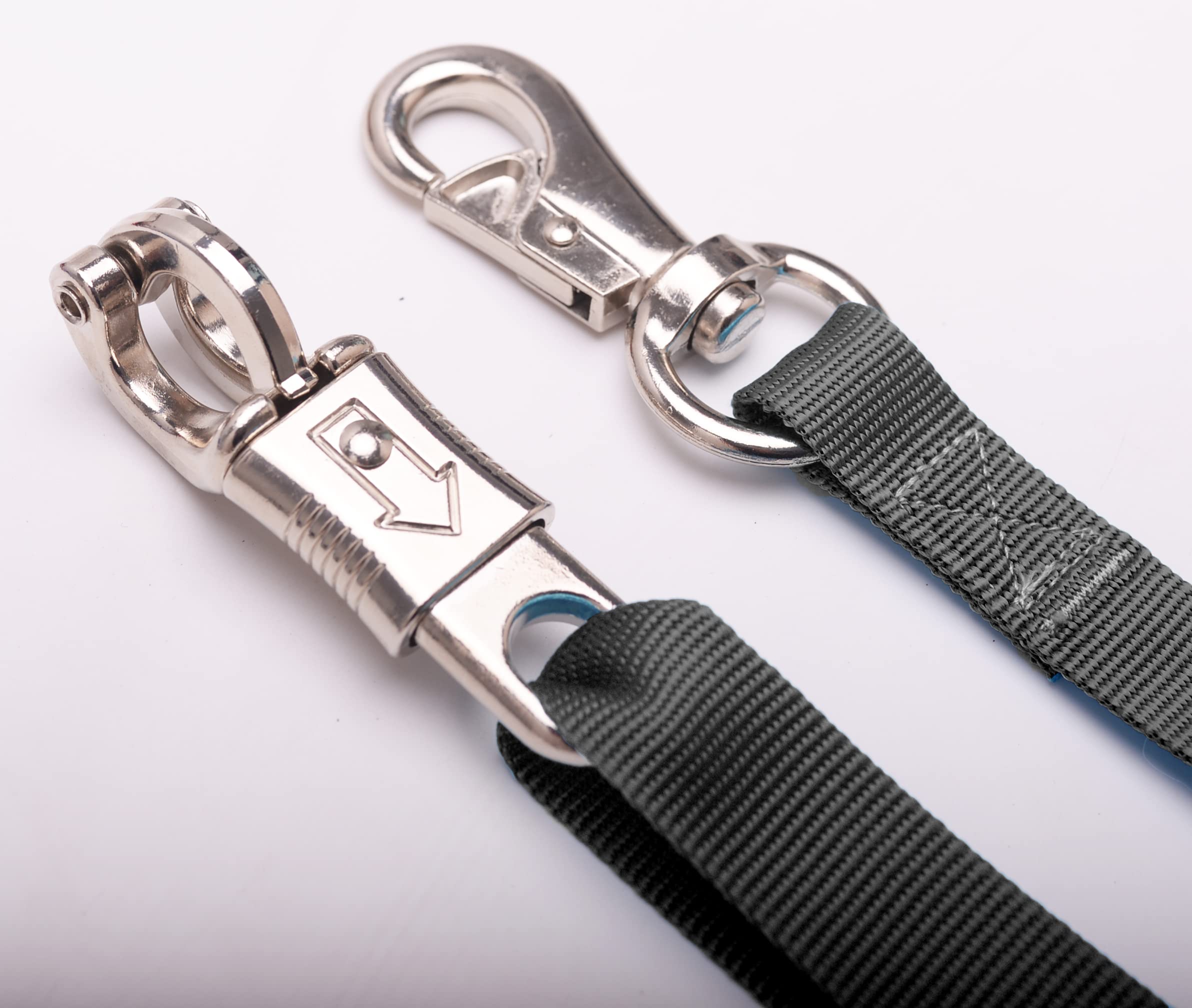 Loaged cross ties in a stable setup enabling easy repositioning for horses.