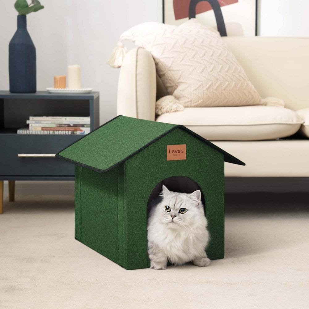 Love's cabin insulated cat house entrance with snowy ambience and cozy shelter.