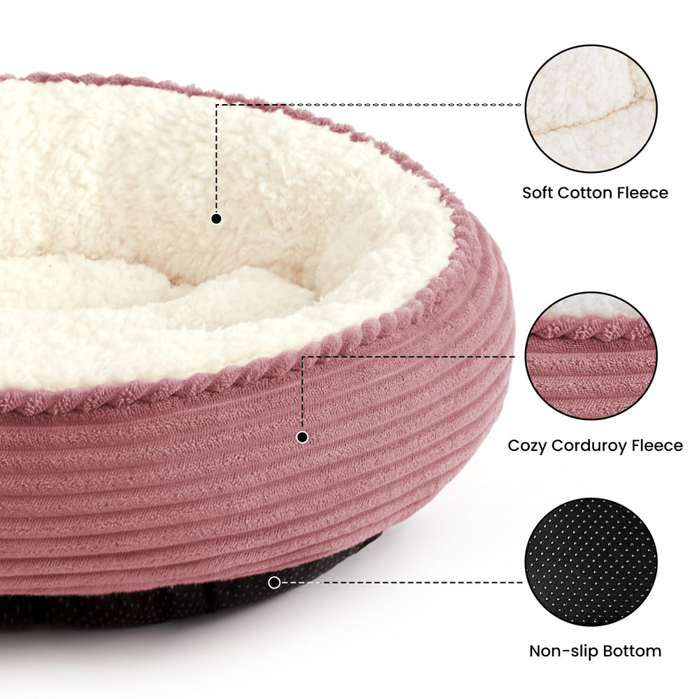 Love's cabin round donut bed side view highlights nest-like walls for security and warmth.