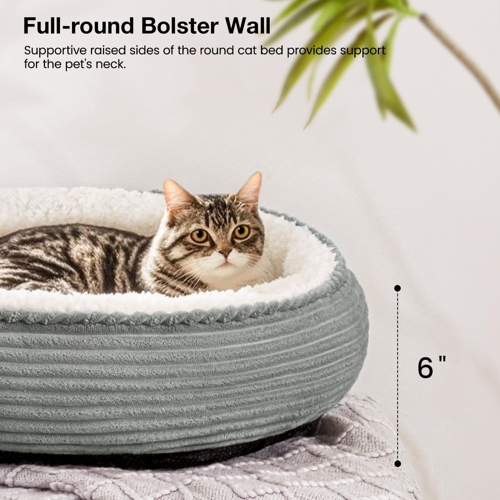 Love's cabin round donut bed water-resistant bottom helps contain spills.
